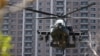 Вертолёт AH-64E Apache на учениях при посадке в городе Синьчжу на северо-западе Тайваня